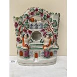 A 19th century Staffordshire watchstand and spill holder in the form of a castle. 10' high