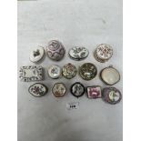 A collection of fourteen porcelain and enamel pill boxes, to include a shell example (14)