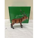 A Beswick model of a red stag. JBC A3. 8½' long. Boxed