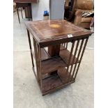 A mahogany and inlaid rotating bookcase. 31½' high