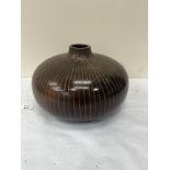 A treen vase of compressed globular form. 11' diam.