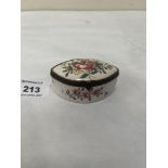 A continental navette shaped pill box painted with sprays of summer flowers in coloured enamels. 2¼'