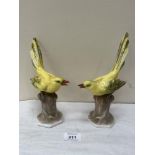 A pair of mid-20th century Portuguese Vista Alegre birds, brightly painted in coloured enamels, each