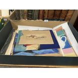 A box of unframed artworks