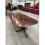A mahogany twin pedestal dining table in George III style with one leaf. 95' long x 42' wide. (Two