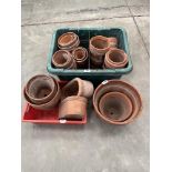 A collection of terracotta plant pots