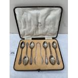 A cased set of six George V silver teaspoons by Walker and Hall. Sheffield 1934. Sugar bow