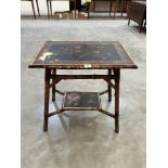 A bamboo side table with chinoiserie decorated lacquer top and undertier. 24' wide