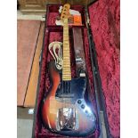 A Fender Jazz Bass guitar with sunburst body. Numbered on heel plate 416667. Hard case with two