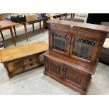 A glazed cabinet and an oak coffee table