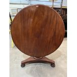 An early Victorian mahogany snap-top supper table. 45' diam