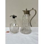 A cut glass claret jug with plated mounts 10' high; together with a cut glass three handled oil