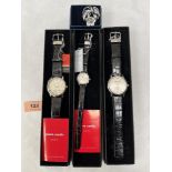 Three Pierre Cardin quartz wristwatches and a white metal brooch