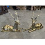 A pair of continental brass models of recumbant stags. 24' long x 19½' high