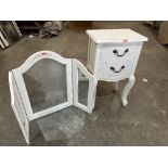 A white painted bedside chest of two drawers and a dressing table mirror