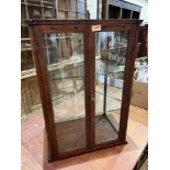 A mahogany shop display cabinet, one glass side pane acid etched for McFarlane, Lang & Co's Rich