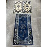 Three oriental wool rugs, the larger 68' x 37'