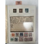 Two albums of British and colonial stamps with a collection of stamped envelopes. Victorian and