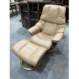 An Ekornes Stressless reclining armchair and footstool upholstered in tan leather