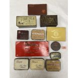A collection of old tobacco and cigarette tins with a Franklyn's patience game
