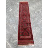 A Meshwani carpet runner. 2.46m x 0.54m