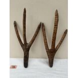 A pair of Australian aboriginal carved treen emu feet with pokerwork decoration. 13' long