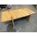 A contempory style light oak coffee table. 56' long