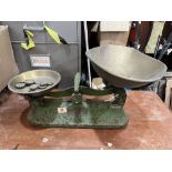 A set of weighing scales with brass weights