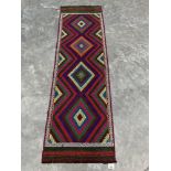 A Suzni Kilim carpet runner. 2.25m x 0.66m