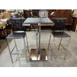 A chrome and leather bar table with two stools