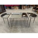 A set of three mid-20th century silver plated and glass topped occasional tables with