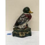 A painted cast iron doorstop in the form of a duck. 9½' high