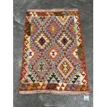 A Choli Kilim rug. 1.2m x 0.81m