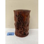 An oriental style brush pot moulded with flowering trees. 5' high