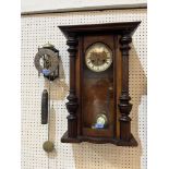 A walnut Vienna style wall clock and a skeleton wall timepiece