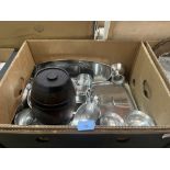 A box of stainless steel cookware and a box of glassware
