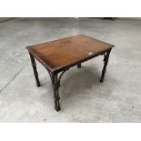 A mahogany low table on cluster column legs. 27' wide
