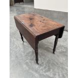 A 19th century mahogany Pembroke table with frieze drawer on ring turned legs. 36' wide