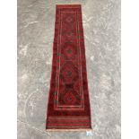 A Meshwani carpet runner. 2.46m x 0.54m