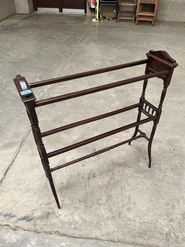 A late Victorian Arts and Crafts mahogany towel rail. 31' wide