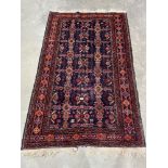 An eastern blue ground rug. 76' x 48'