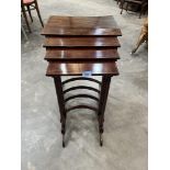 A nest of mahogany quartetto tables with line inlaid tops on faux bamboo spider legs. (Two tables