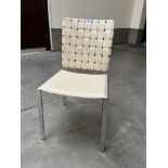 A chrome and cream leather chair