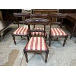 A set of four William IV mahogany tablet back dining chairs