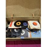 A case of 7' vinyl single records. Assorted.