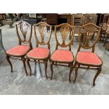 A set of four Thonet shield-back dining chairs
