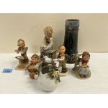 Four Hummel figures; another figure; a Royal Doulton vase and a porcelain basket
