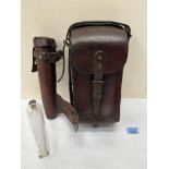 A 19th century leather saddle bag, 12' high and a leather cased hunting flask