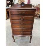 An early 20th century mahoghany music chest of six fall-front drawers on cabriole legs. 38' high.