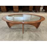 A 1970s G-Plan Teak elipsoidal coffee table with inklet glass top. Split to top